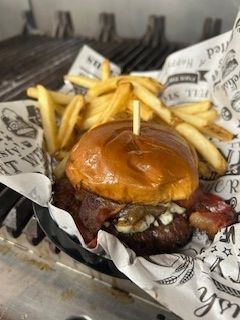 A JEM smash burger with bacon and fries